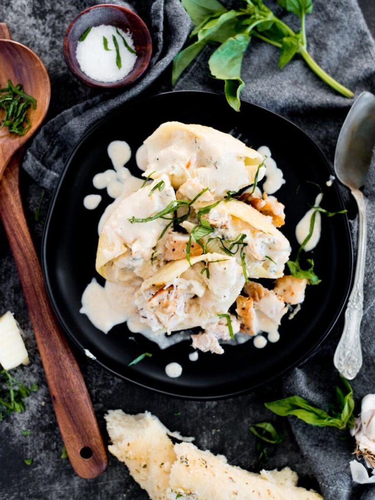 Conchiglie Ripiene di Pollo e Ricotta 2 creamy chicken and ricotta stuffed shells topped with basil