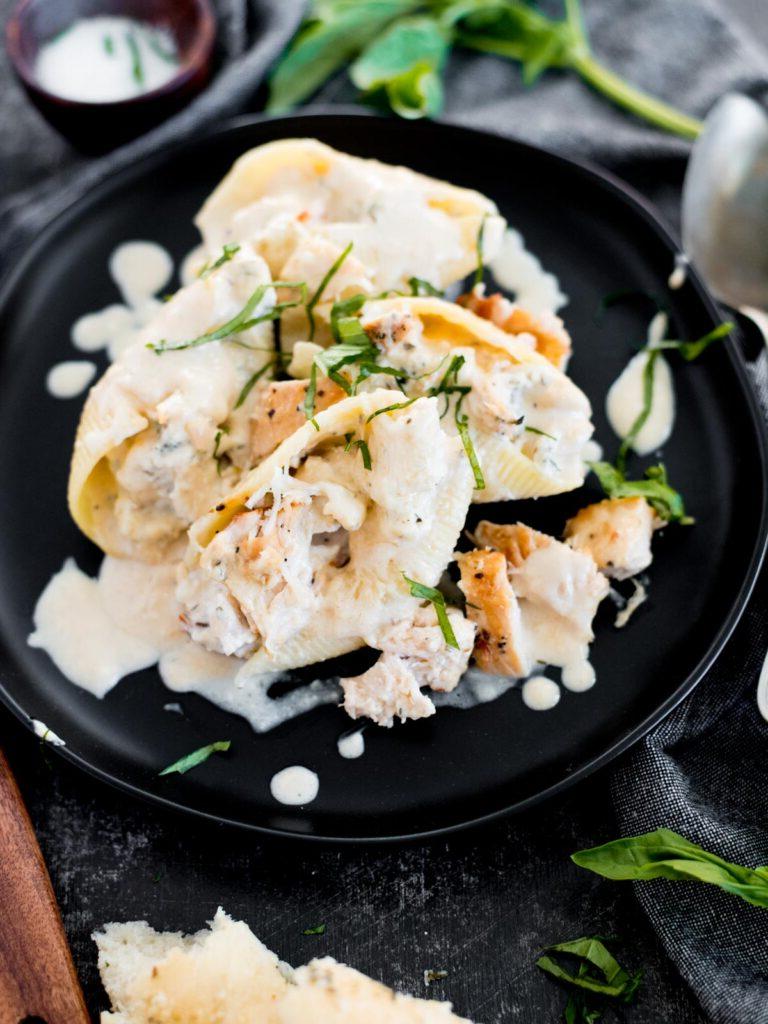 Conchiglie Ripiene di Pollo e Ricotta 12 creamy chicken and ricotta stuffed shells topped with basil