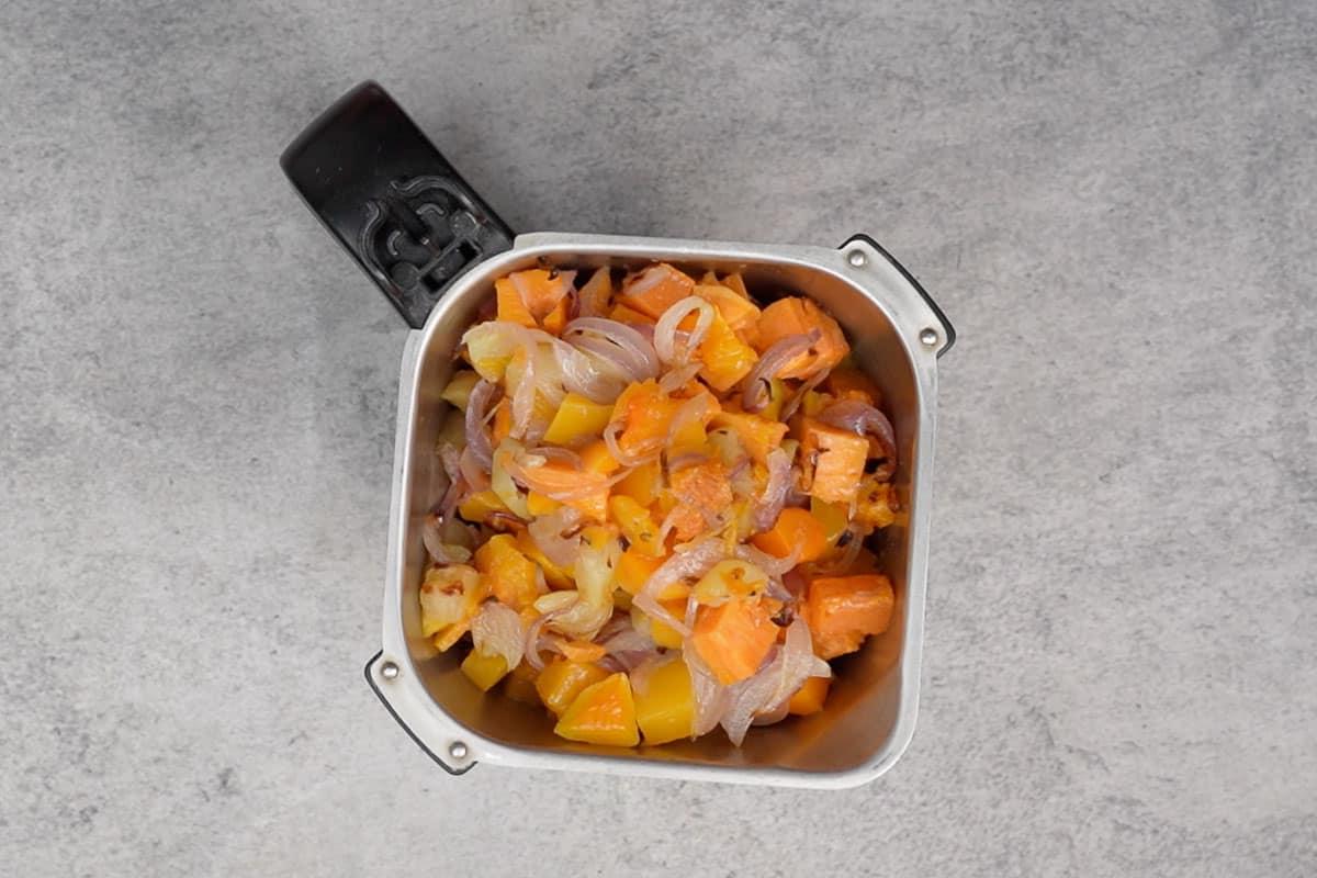 Roasted veggies transferred to a blender.