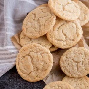 condensed milk cookies stacked on a countertop