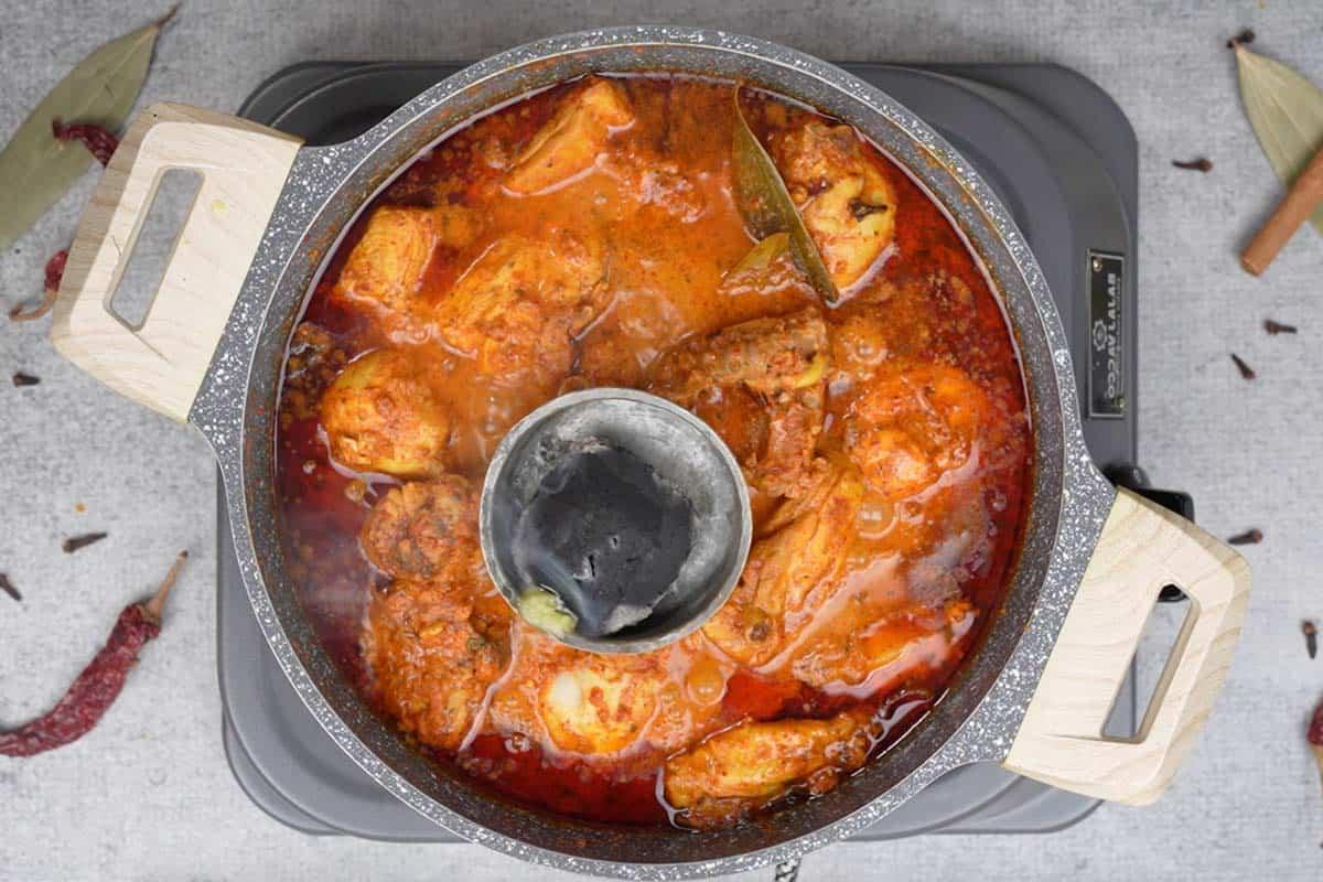 Pollo Angara 16 Ghee drizzled over hot charcoal.