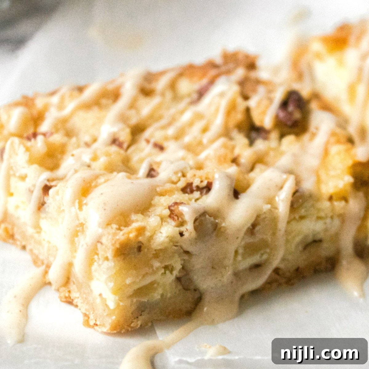 Close up of one pineapple coconut bar, showing the texture and deliciousness.