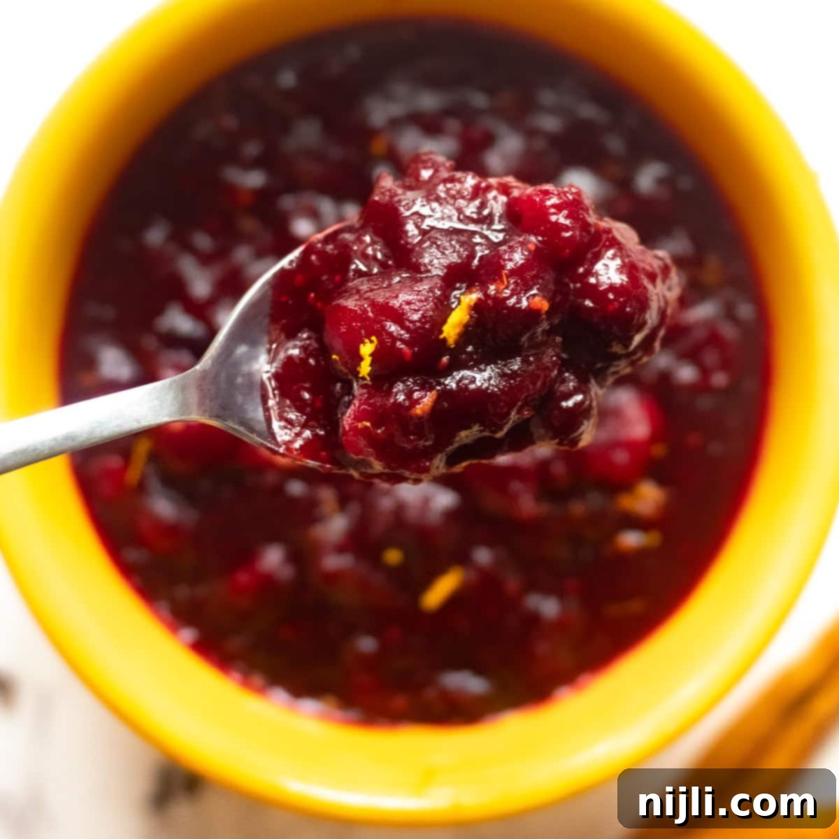 spoonful of keto cranberry sauce, sweetened with Swerve