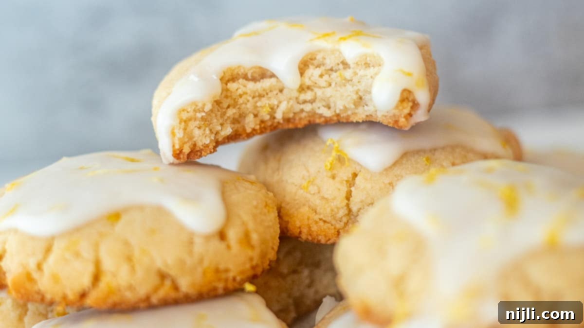Nutty Lemon Bliss Cookies 5 Healthy lemon almond cookies neatly arranged, showcasing their golden edges and bright glaze.