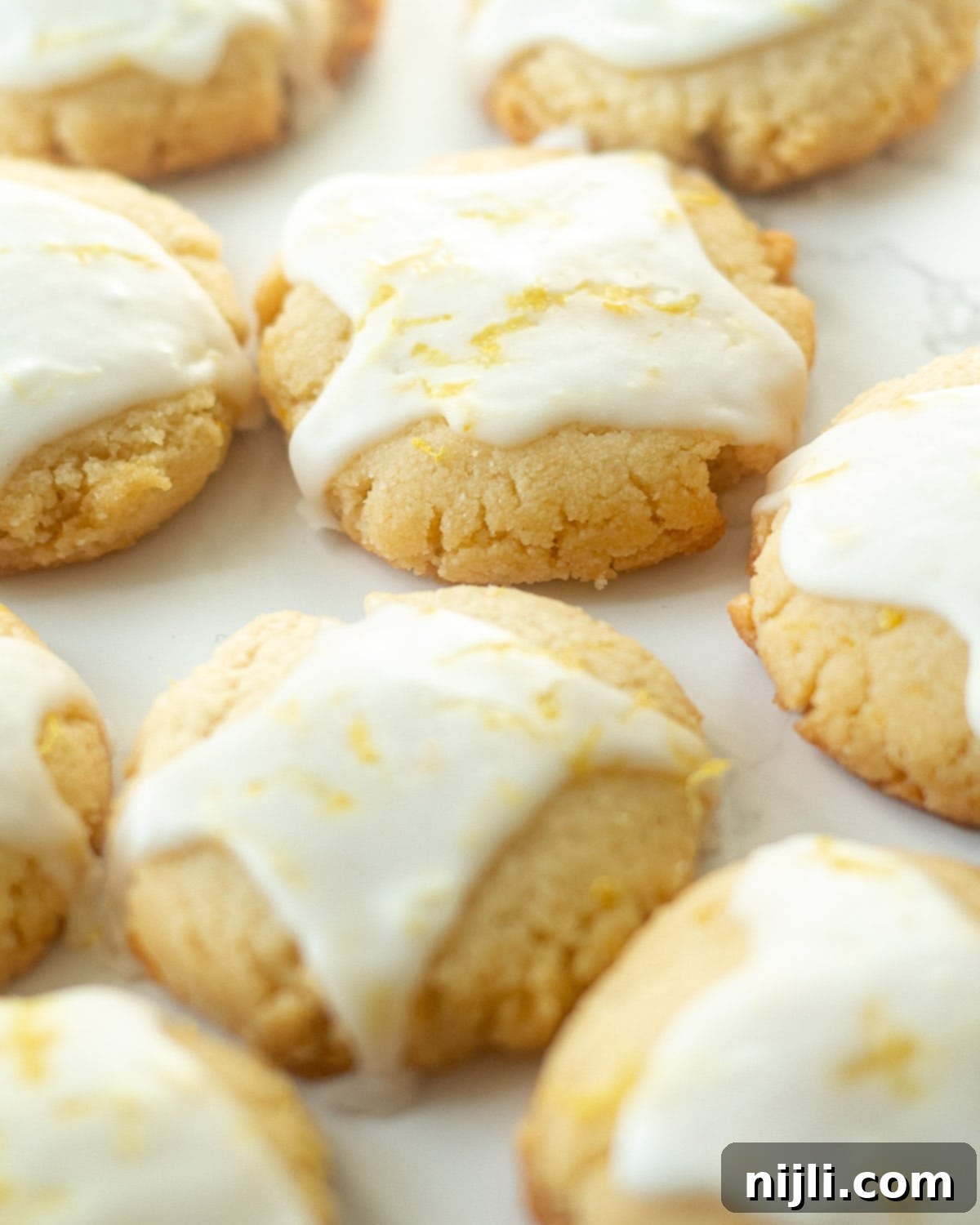 Nutty Lemon Bliss Cookies 6 A tray full of healthy lemon cookies, freshly baked and ready to be glazed.
