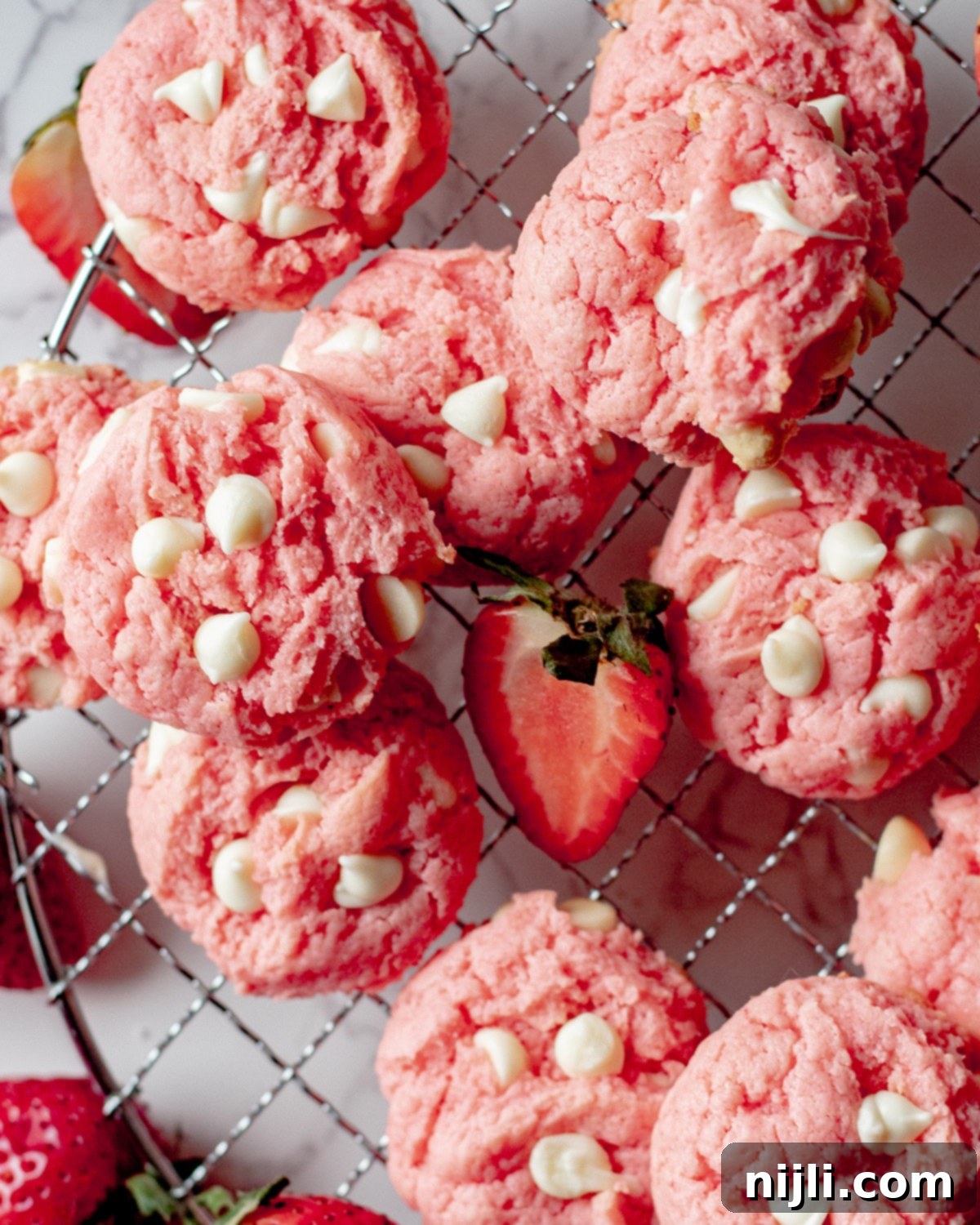 overhead shot of strawberry cookies on a wire rack