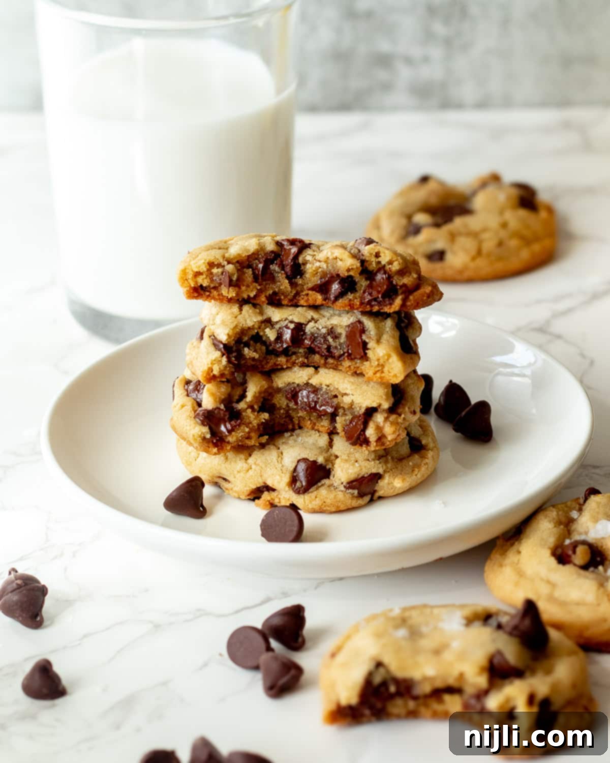 Vegan Chocolate Chip Cookies 3 Stack of freshly baked dairy free chocolate chip cookies with gooey melted chocolate chips peeking out