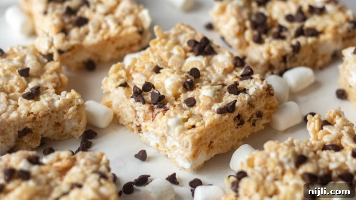 Gooey Chocolate Chip Rice Krispie Bars 5 Chocolate chip rice krispie treats on a tray, ready to be cut