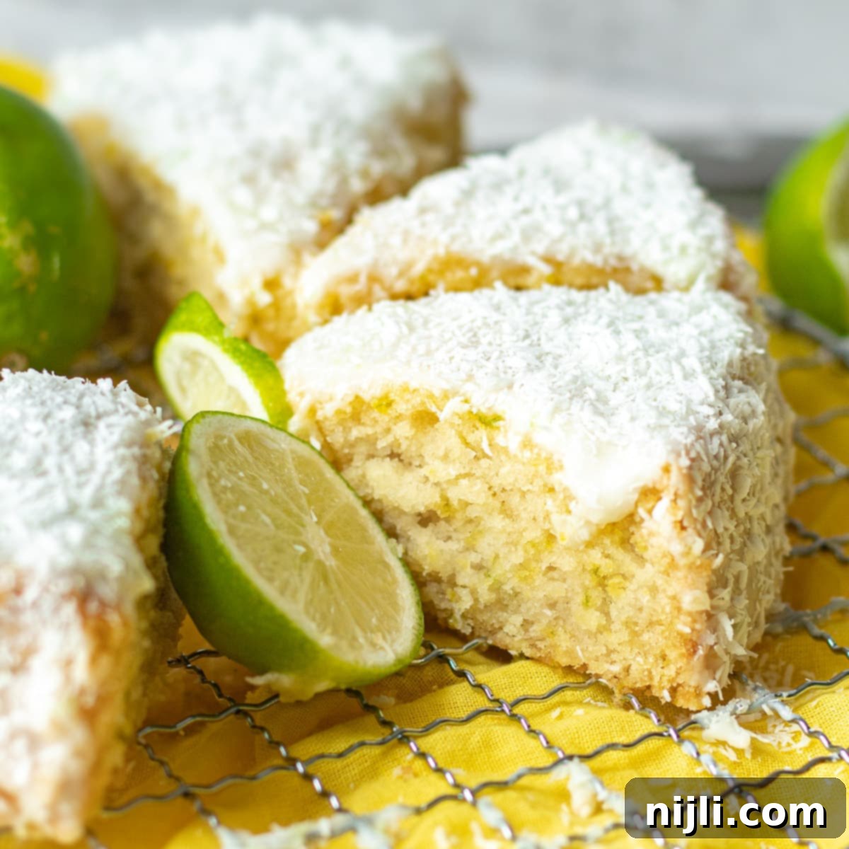 Tropical Vegan Coconut Delight 2 slices of vegan coconut cake on a tray