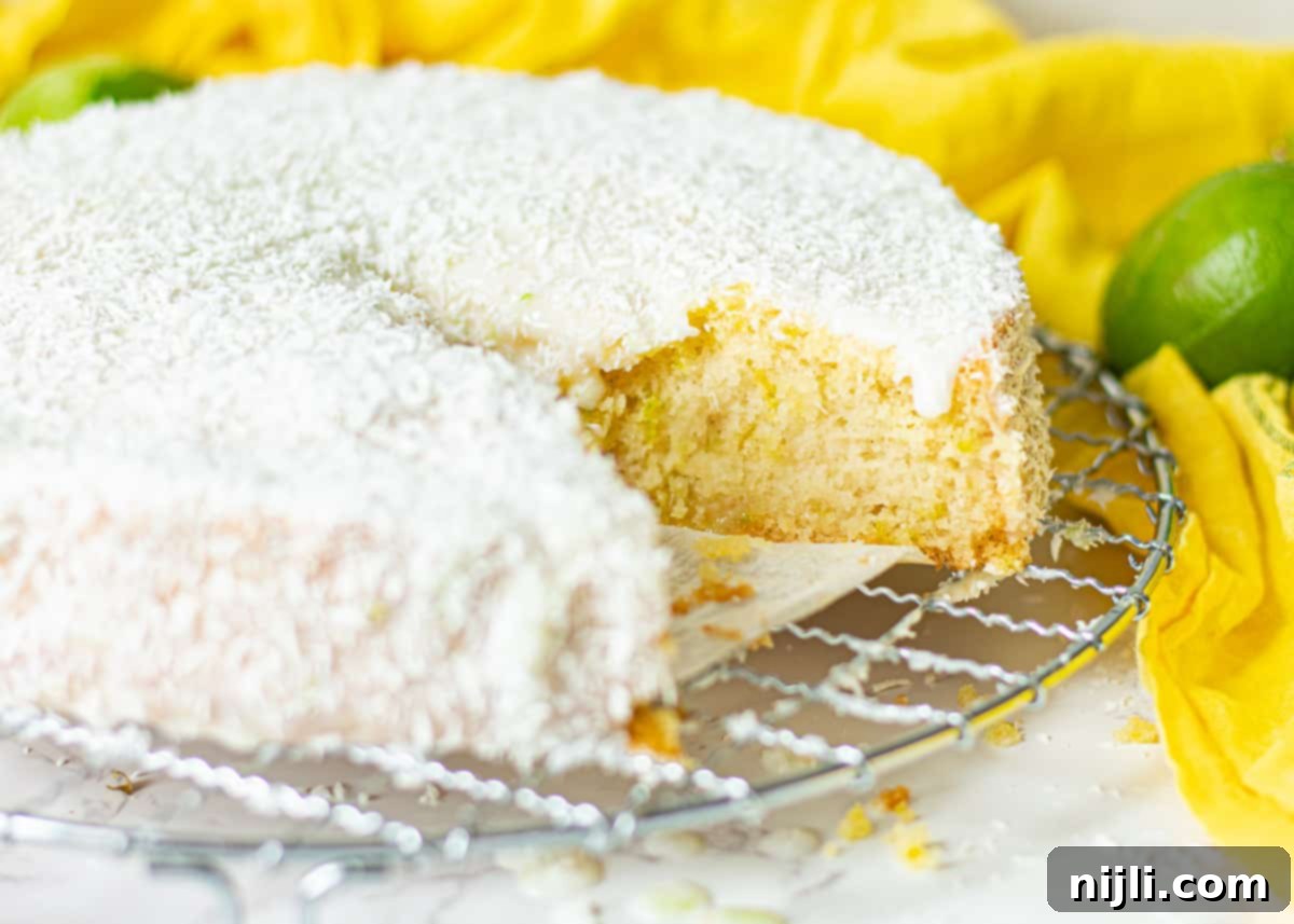 Tropical Vegan Coconut Delight 4 vegan coconut and lime cake with a piece cut out