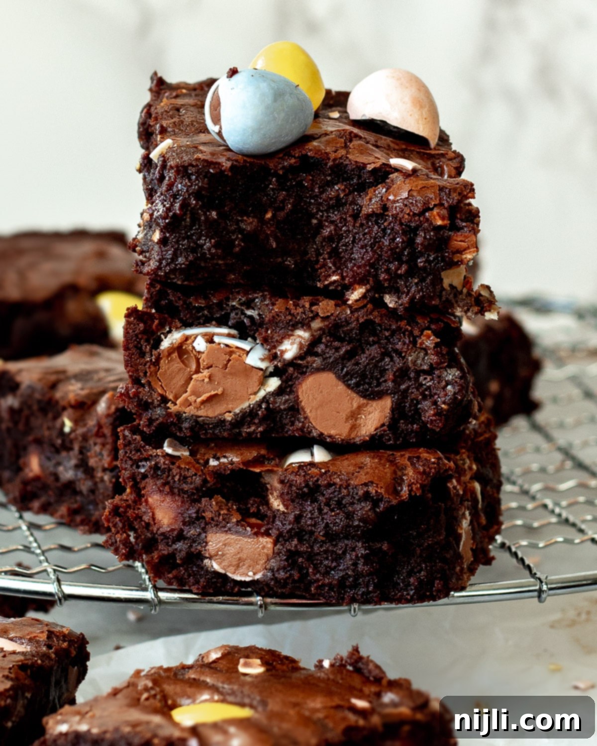 Mini Egg Brownies 3 brownie recipe stacked on a tray