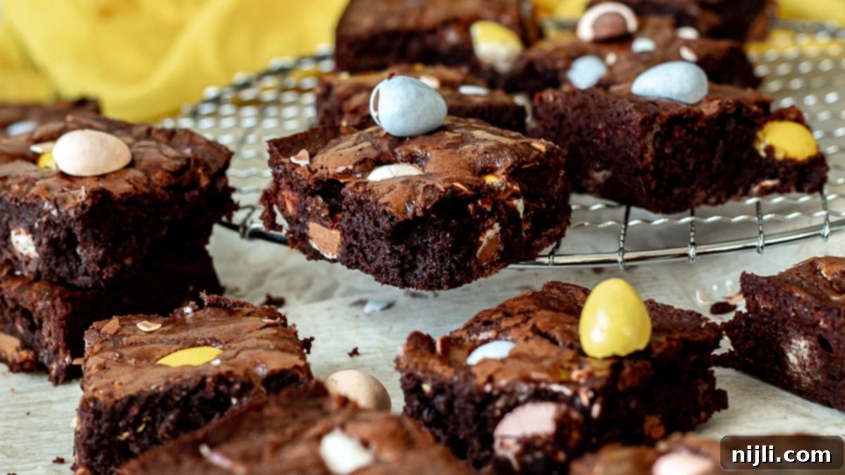 brownies with cadbury mini eggs on a rack