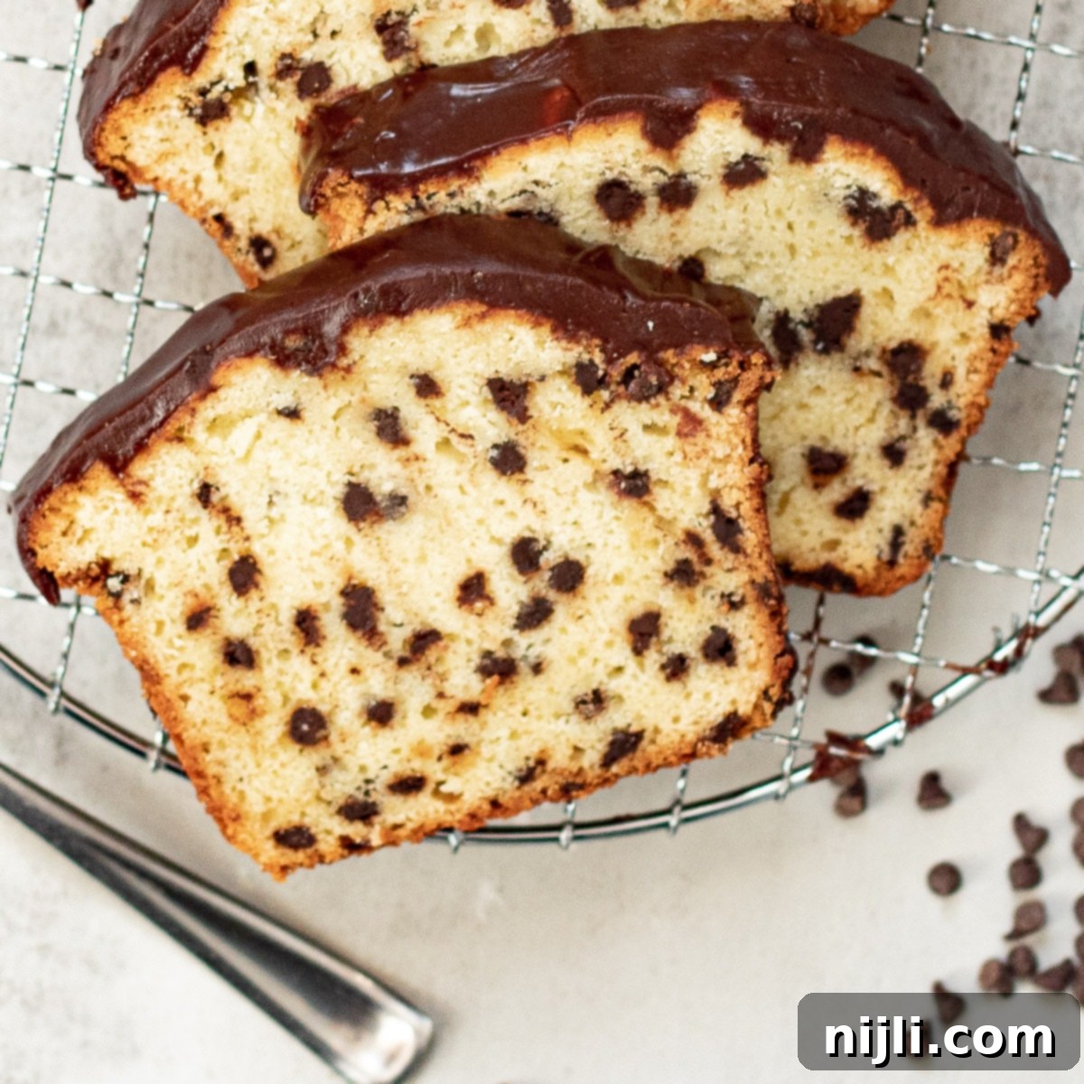 Decadent Chocolate Chip Loaf 7 slices of chocolate chip loaf cake on a tray