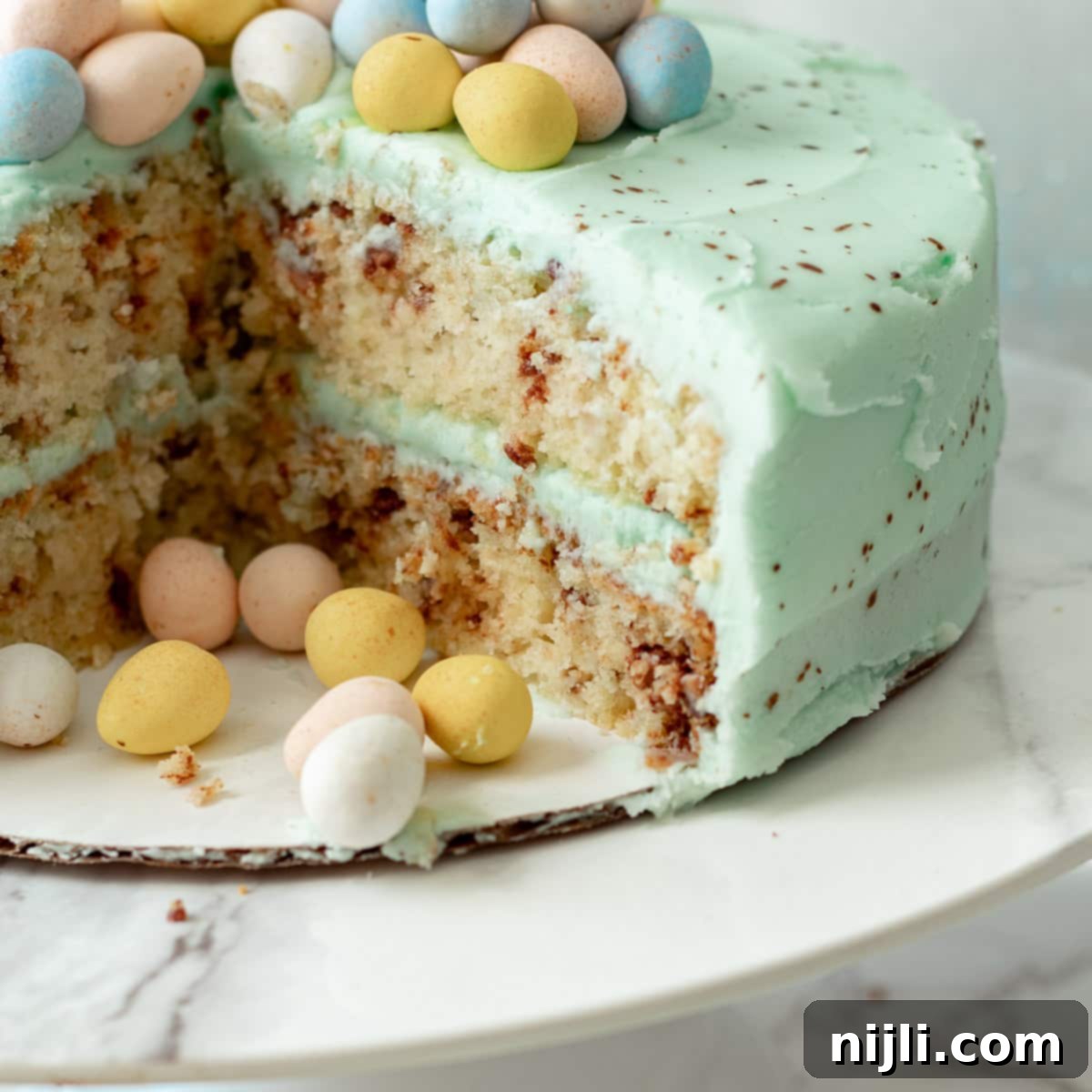 Speckled Candy Cake 6 cut mini eggs cake on a cake stand