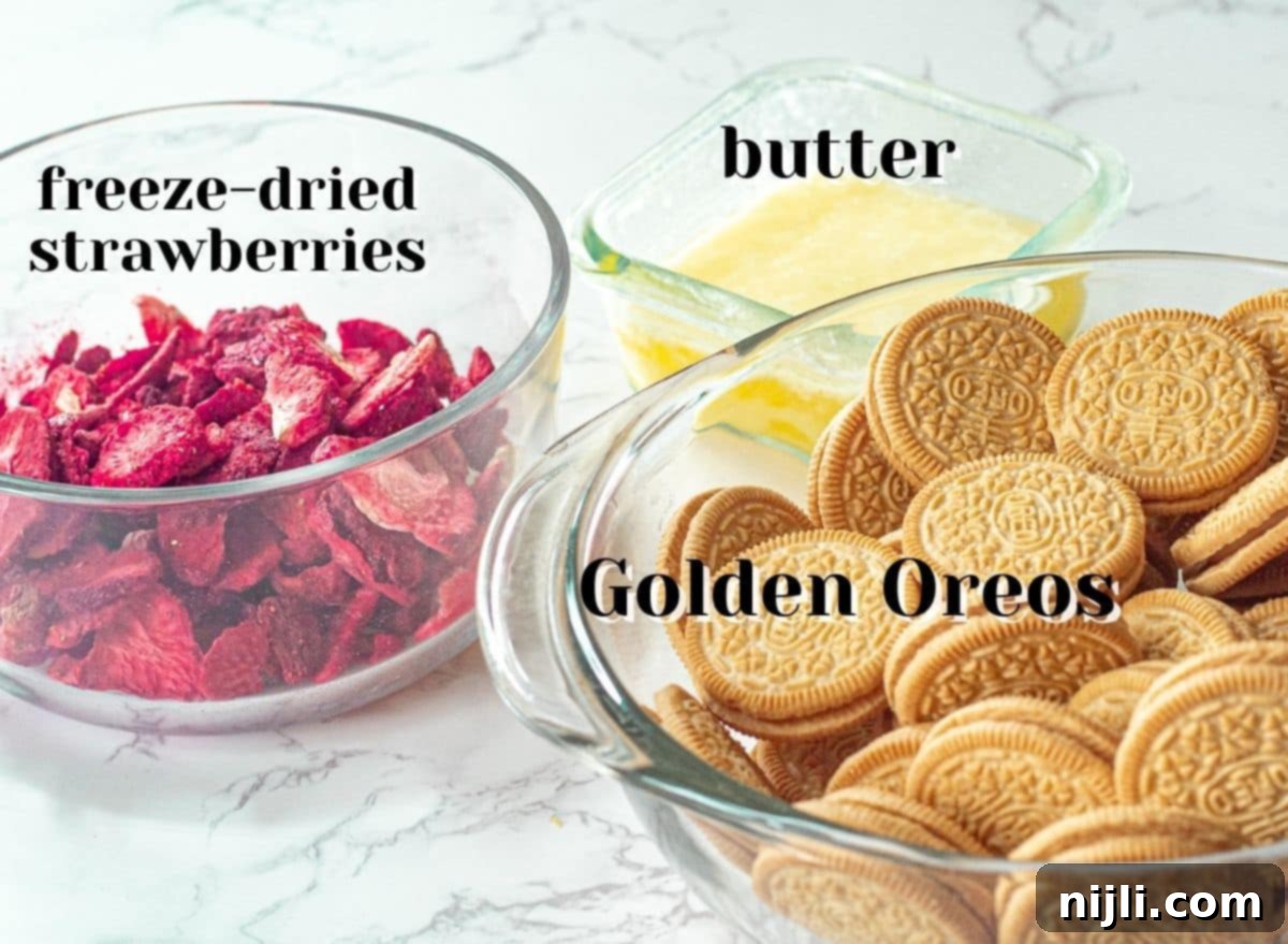 Classic Strawberry Shortcake Crumble 4 Ingredients for homemade strawberry crunch topping, including freeze-dried strawberries, Golden Oreo cookies, and melted butter, neatly arranged for preparation.