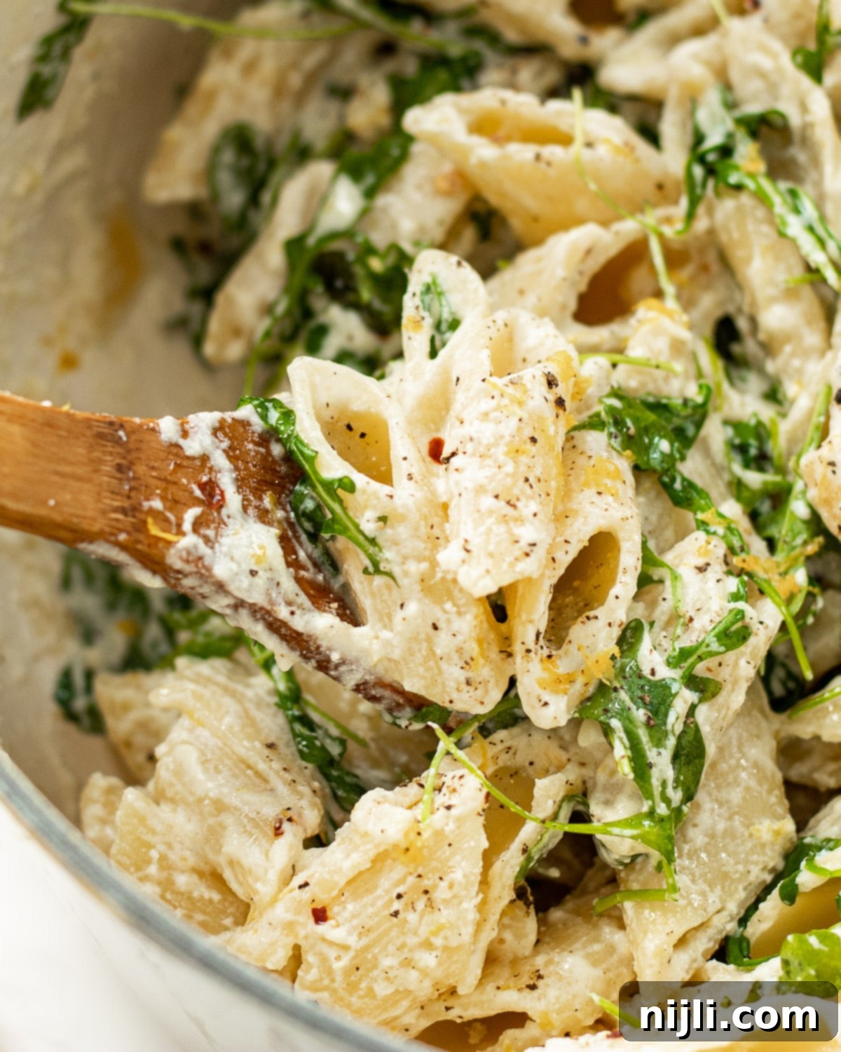 Vibrant Lemon Ricotta Pasta 6 ricotta lemon pasta in a pot with a spoon
