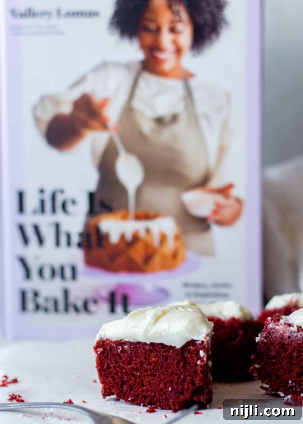 Petite Red Velvet Delights 6 mini red velvet cake with cookbook in the background