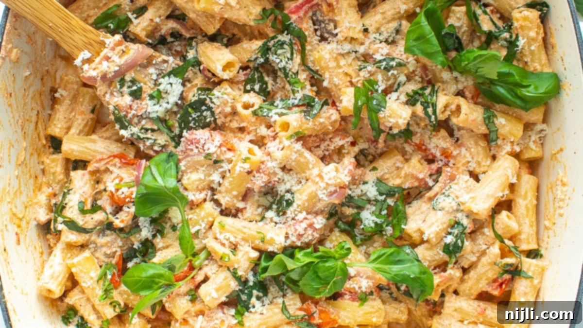 Creamy Goat Cheese Pasta Bake 3 Creamy Baked Goat Cheese Pasta with Spinach and Mushrooms after cooking, stirred with pasta and fresh basil