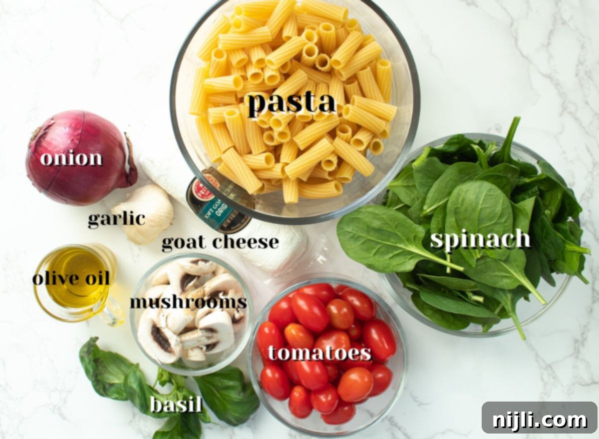 Creamy Goat Cheese Pasta Bake 5 Ingredients for Baked Goat Cheese Pasta with Mushrooms and Spinach, including tomatoes, goat cheese log, red onion, garlic, and fresh spinach