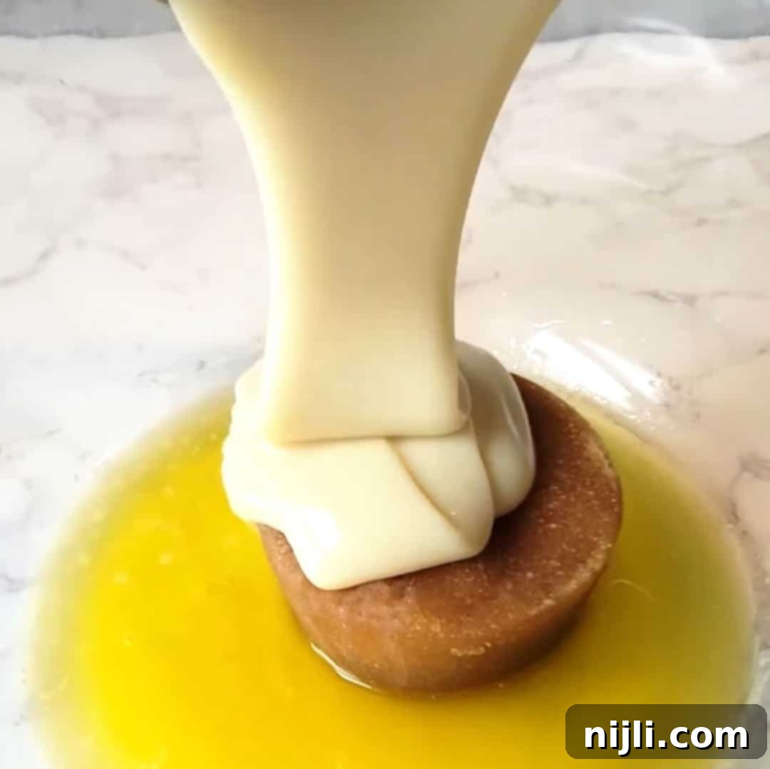 Pouring condensed milk into a bowl with butter and brown sugar to start making sweetened condensed milk brownies.