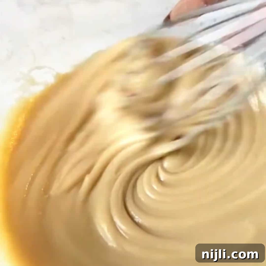 Whisking mixture for brownies with condensed milk.