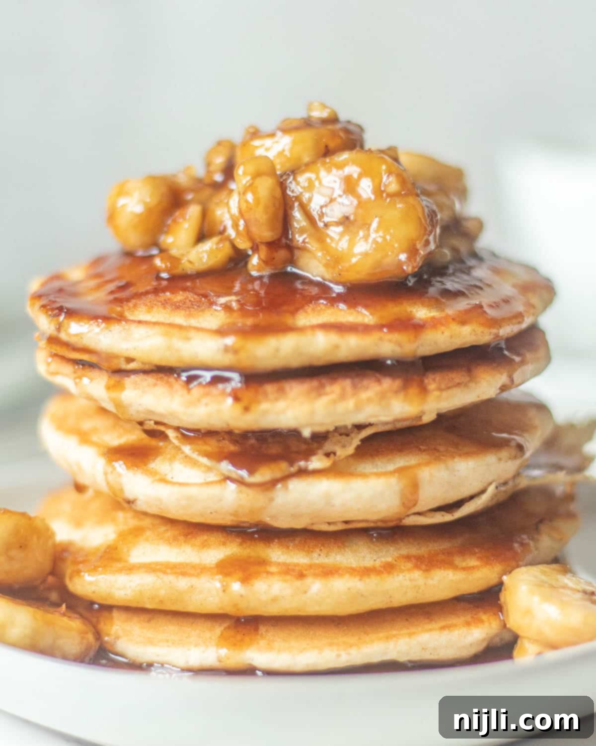 banana topping for pancakes in a stack
