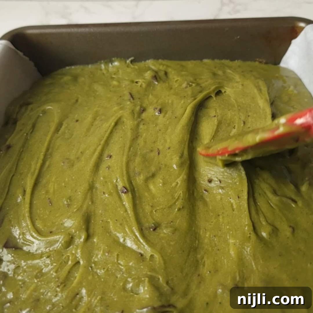 Green Tea Dream Brownies 11 Step 5: Spreading smooth matcha brownie batter into a parchment-lined baking pan