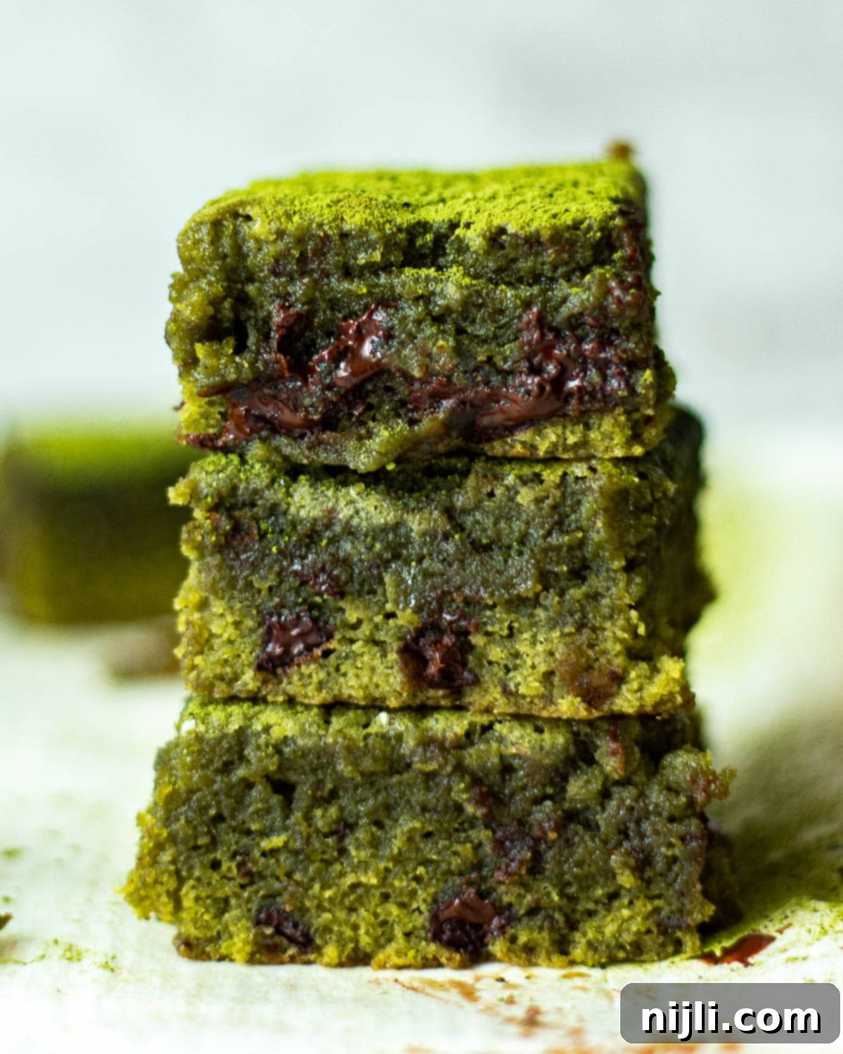 Green Tea Dream Brownies 13 Stack of plain matcha brownies without chocolate chunks, showing their rich green color