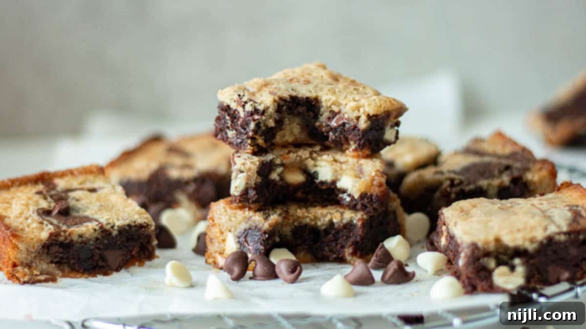Pecan blondie brownie recipe stacked with chocolate chips scattered around.