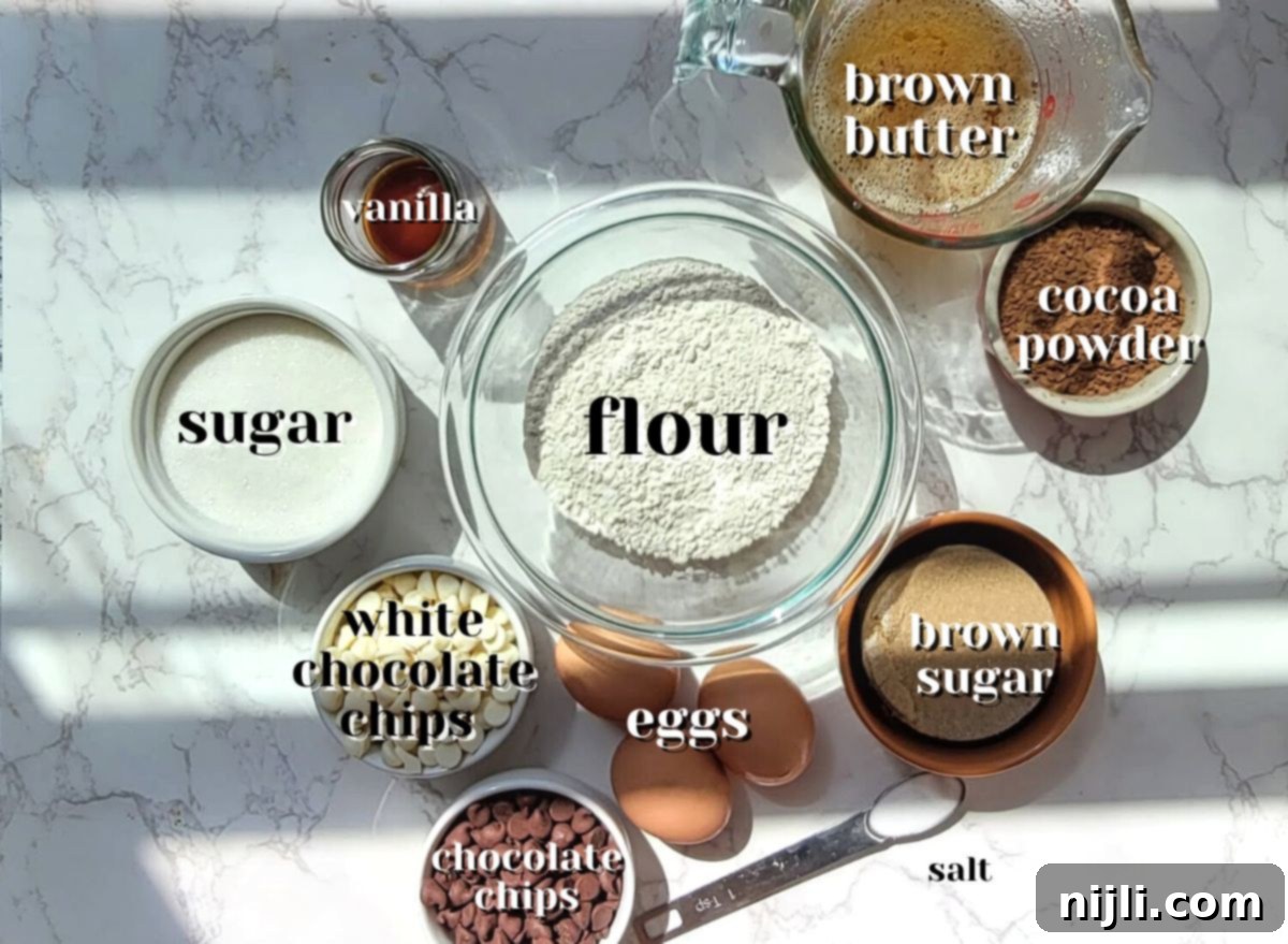 Ingredients for chocolate brownie blondies recipe laid out on a surface.