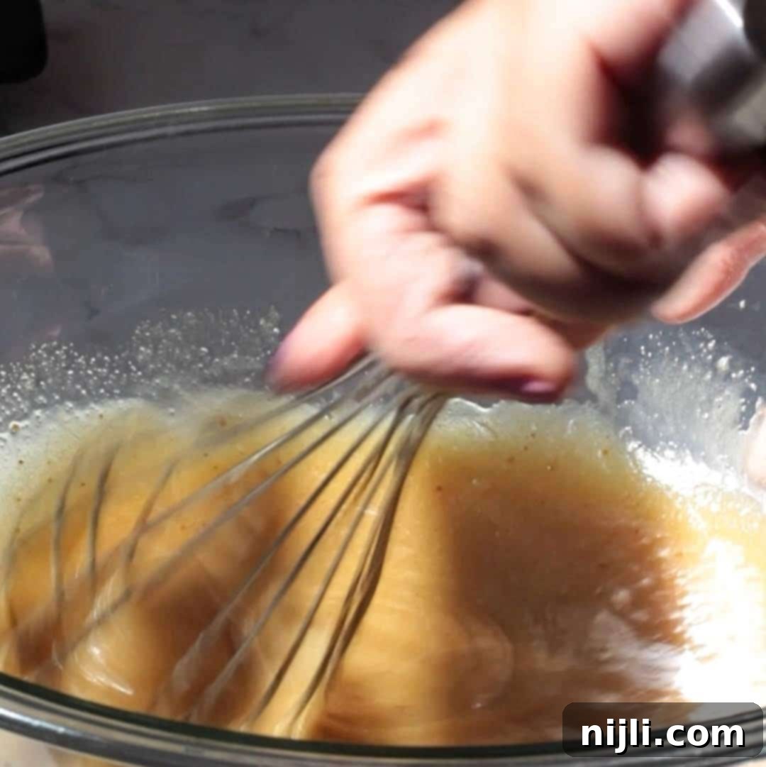 Step 1: Whisking wet ingredients for blondie brownie batter.