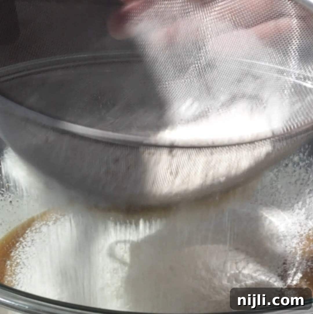 Step 2: Folding flour and salt into blondie brownie batter.