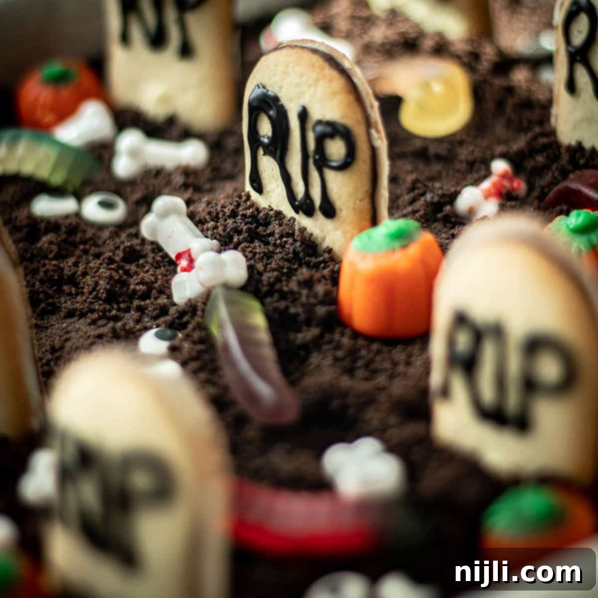 Tombstone Brownies 2 Halloween graveyard brownies in a brownie pan, ready to be served at a spooky party.