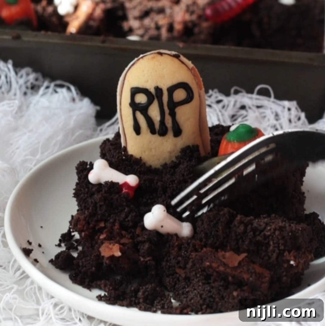 Tombstone Brownies 9 Step 4: A finished tray of Graveyard Halloween Brownies, cut into squares and ready to be enjoyed.