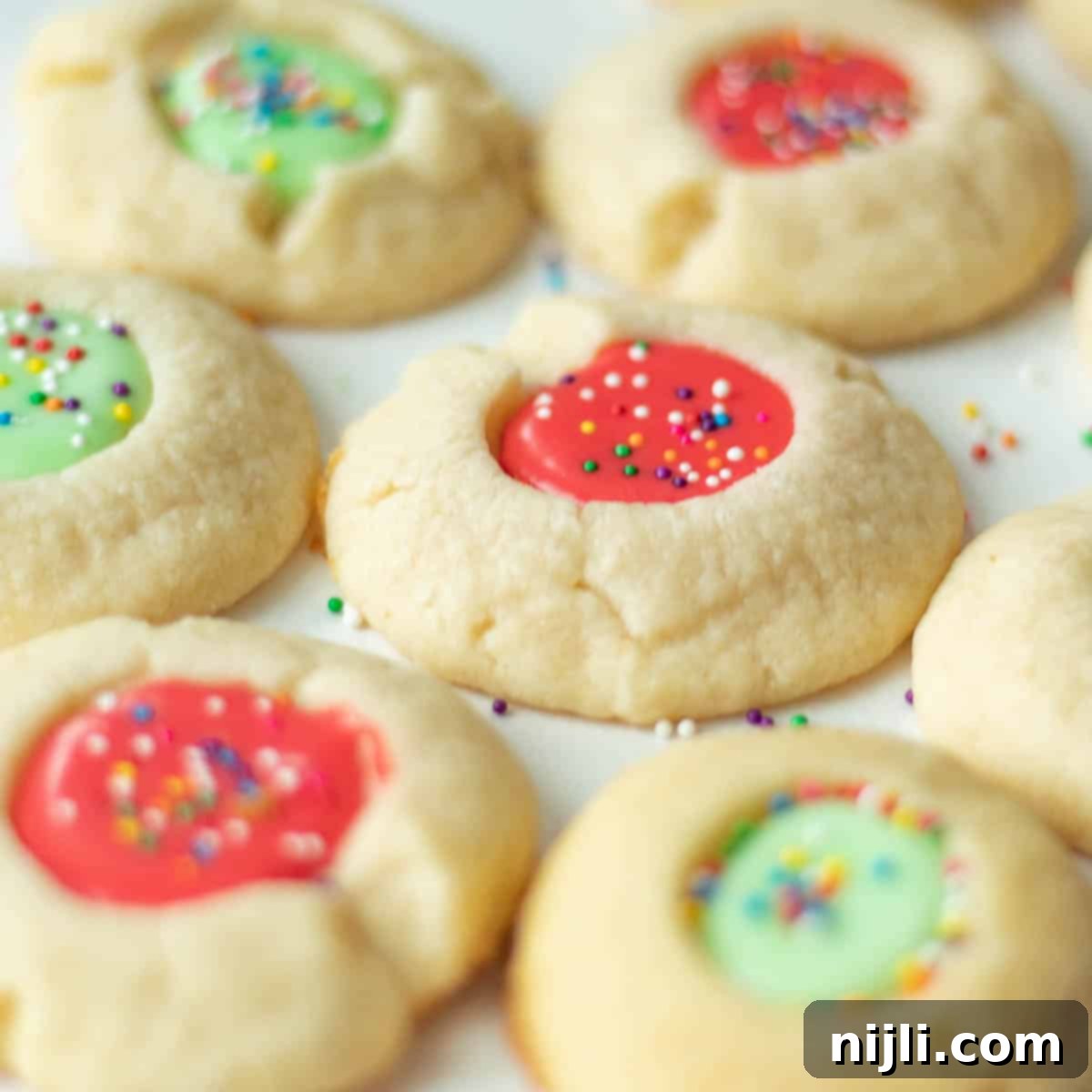 Iced Thumbprint Cookies 2 thumbprint cookies with icing