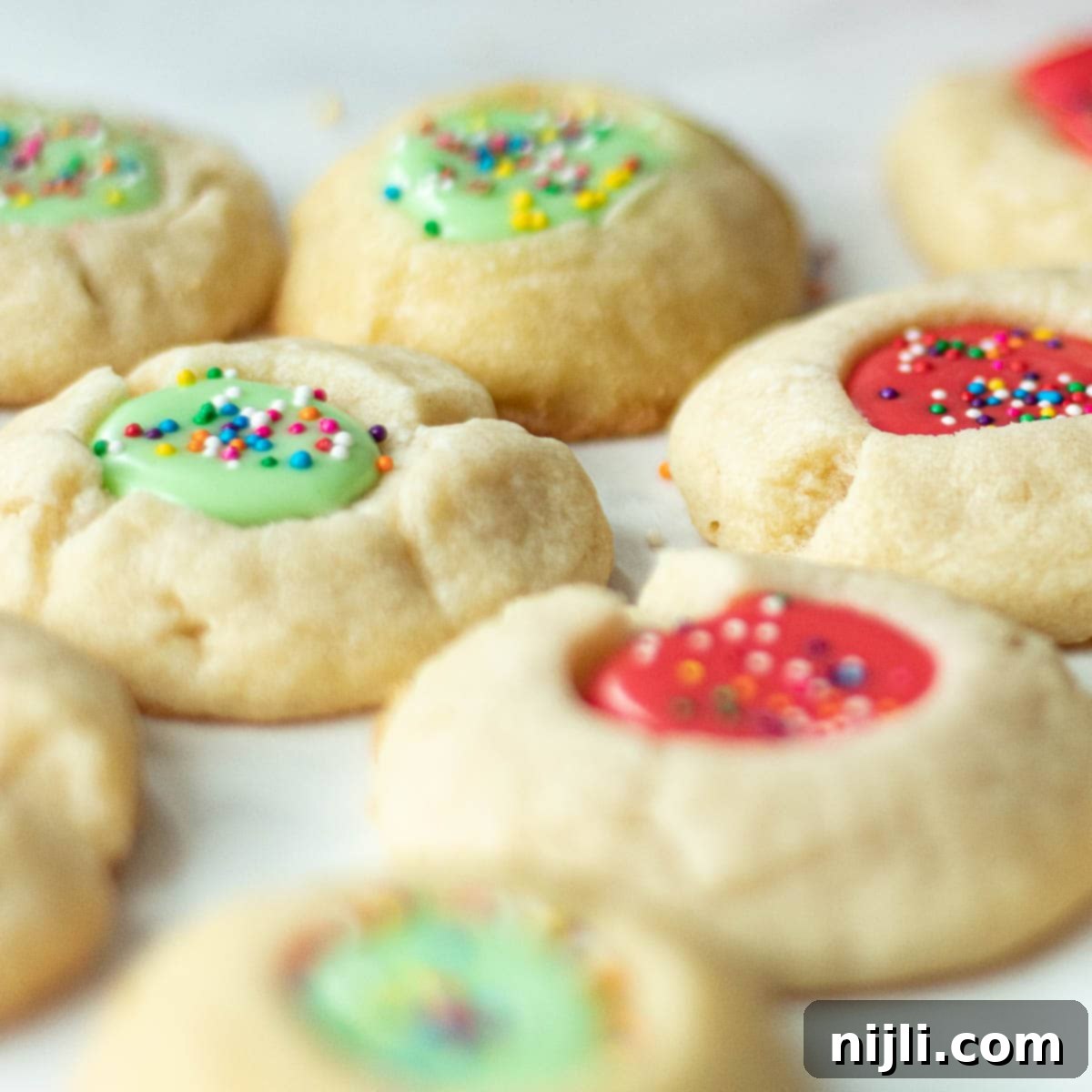 Iced Thumbprint Cookies 10 thumbprint cookies with icing and nuts