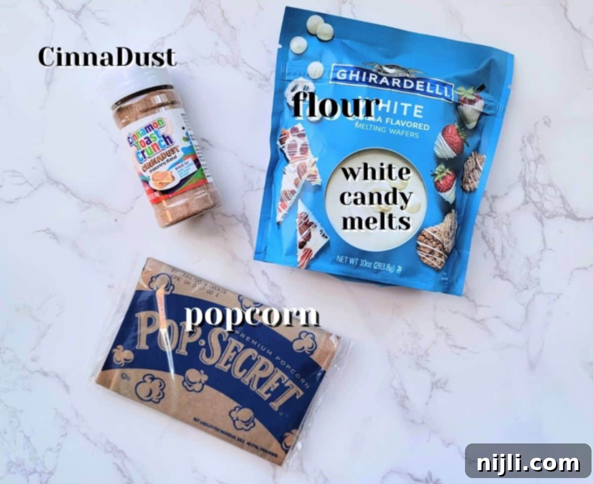 Ingredients for Cinnamon Toast Crunch Popcorn including popcorn, white chocolate, and CinnaDust