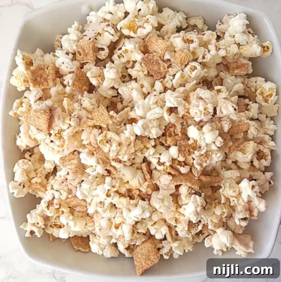 Step 4: Adding Cinnamon Toast Crunch cereal and serving the popcorn