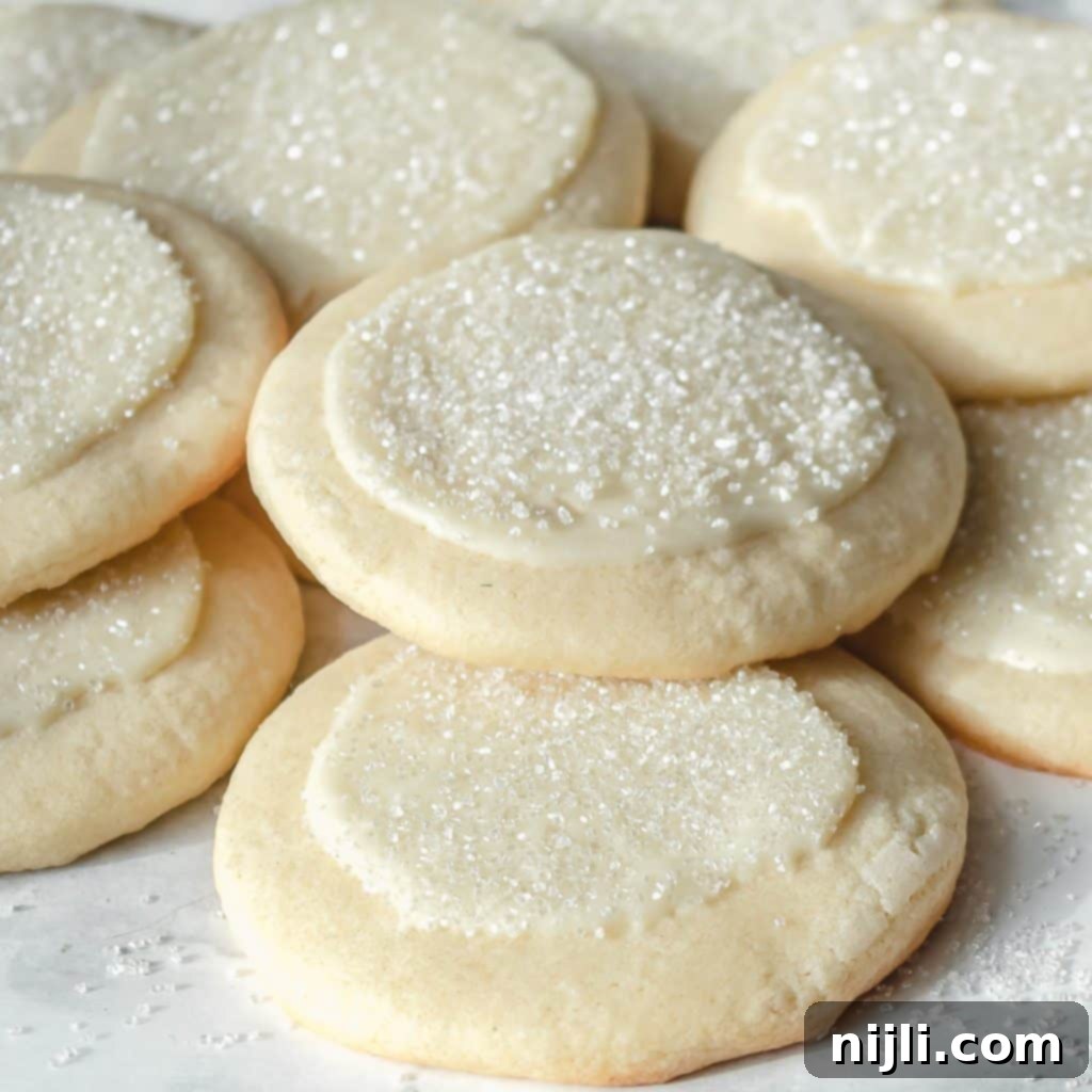 White Chocolate Peppermint Sugar Cookie Bliss 2 overhead shot of peppermint white chocolate sugar cookies on parchment paper