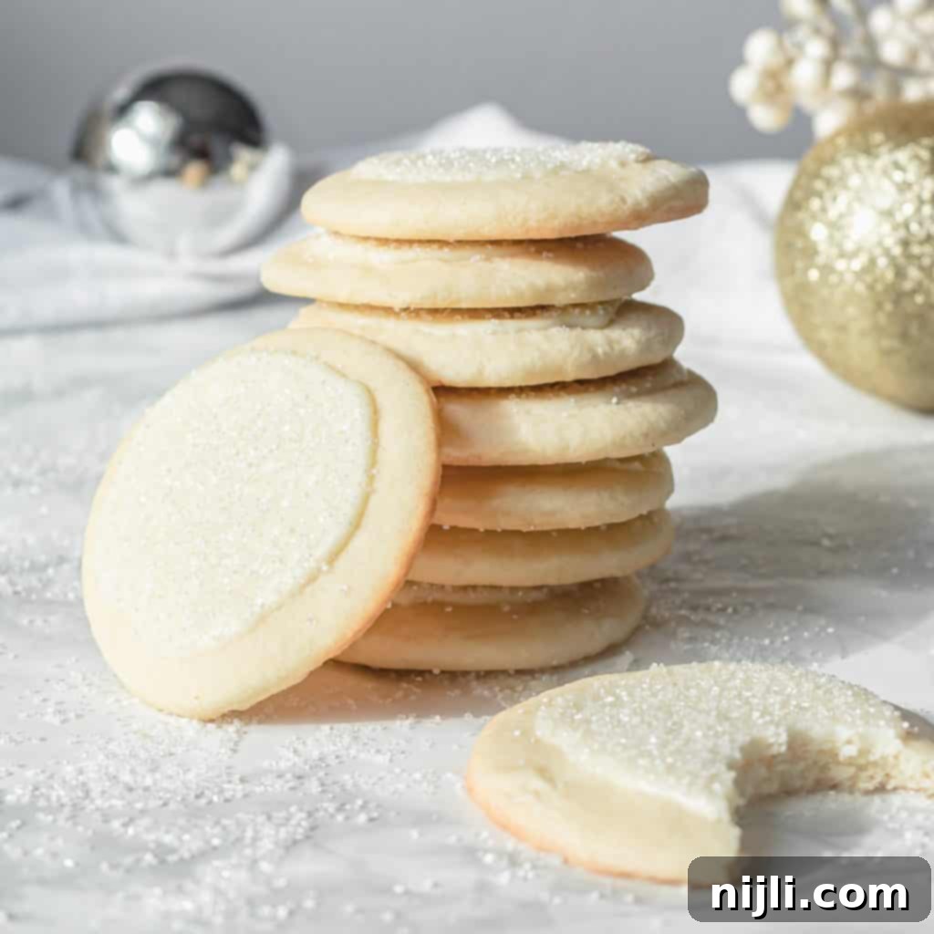 White Chocolate Peppermint Sugar Cookie Bliss 4 stack of peppermint white chocolate sugar cookies with one cookie bit