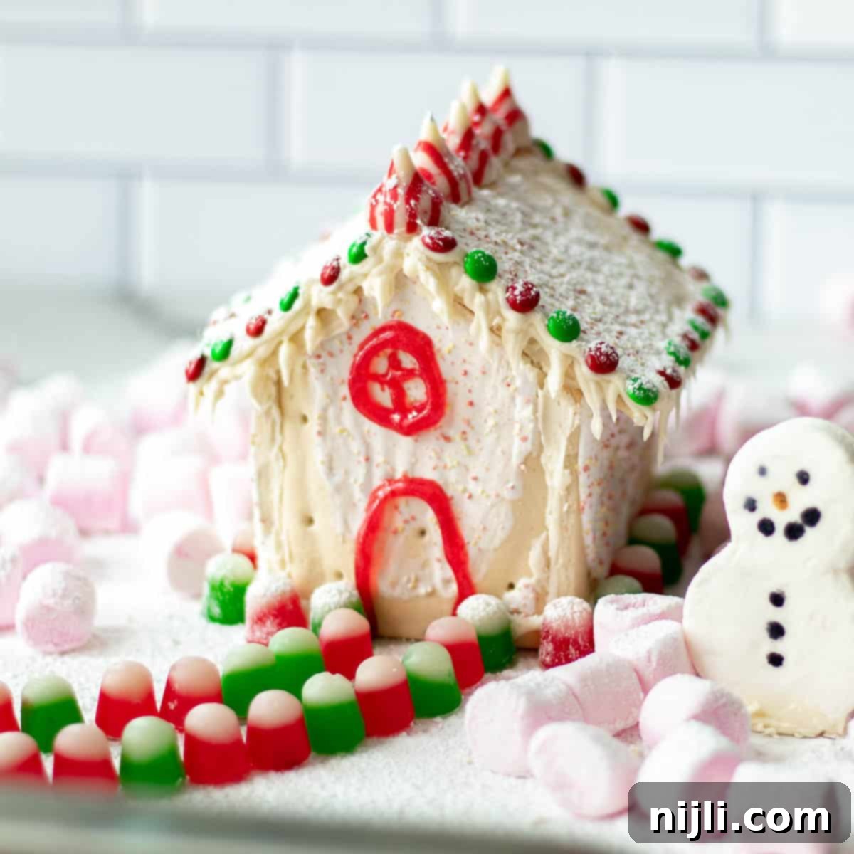 pop tart gingerbread house decorated with candy and marshmallows