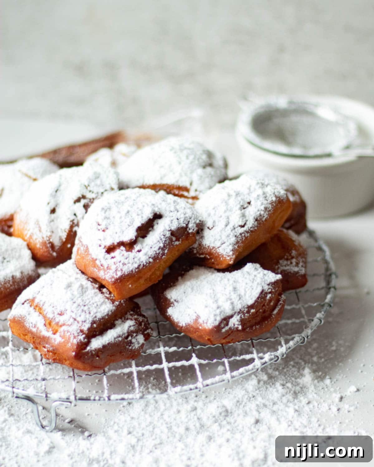 Decadent Chocolate Beignets 5 chocolate beignets on a tray, ready to be served