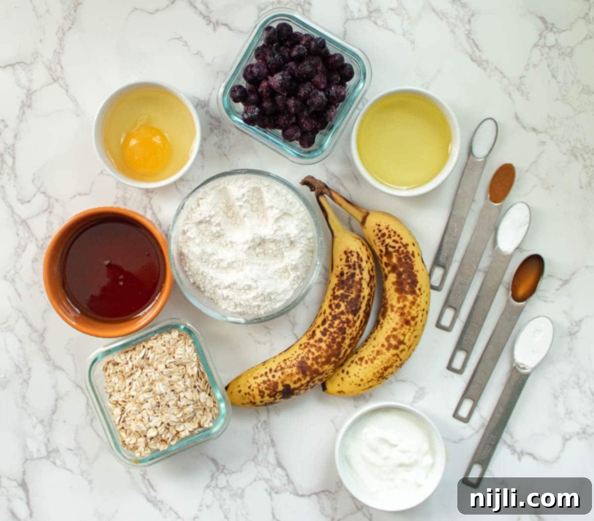 ingredients for banana blueberry oatmeal muffins laid out
