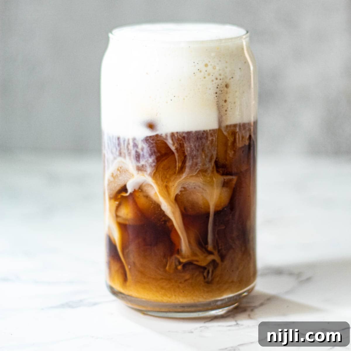 Homemade Sweet Cream Cold Foam 2 sweet cream cold foam recipe in a glass, ready to be enjoyed with a spoon