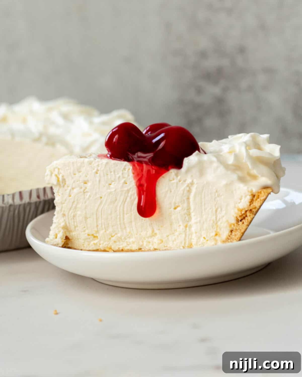 No-Bake Philadelphia Cool Whip Cheesecake 9 A beautiful no-bake cheesecake recipe from Allrecipes, showcasing its creamy texture and simple elegance.