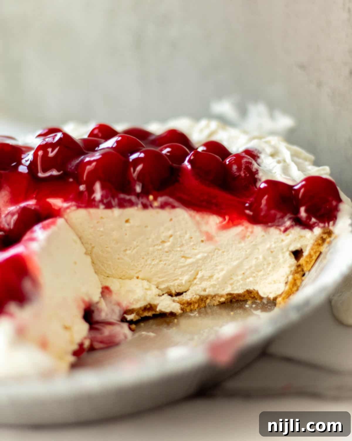 No-Bake Philadelphia Cool Whip Cheesecake 10 A beautifully set Cool Whip and cream cheese cheesecake, garnished with fresh berries.