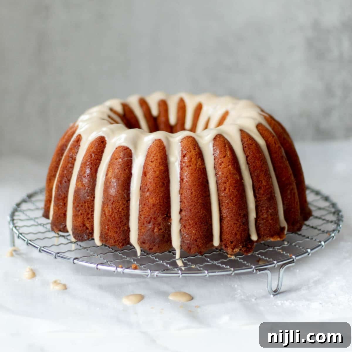 Pound Cake Versus Bundt Cake Explained 2 rum soaked cake recipe on a wire rack