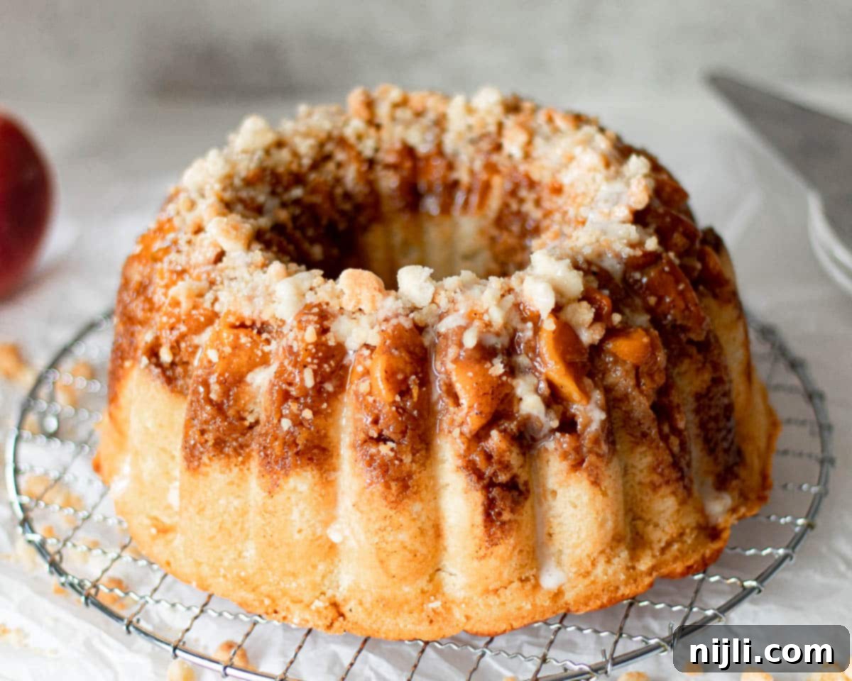 Pound Cake Versus Bundt Cake Explained 9 peach cobbler pound cake on a rack