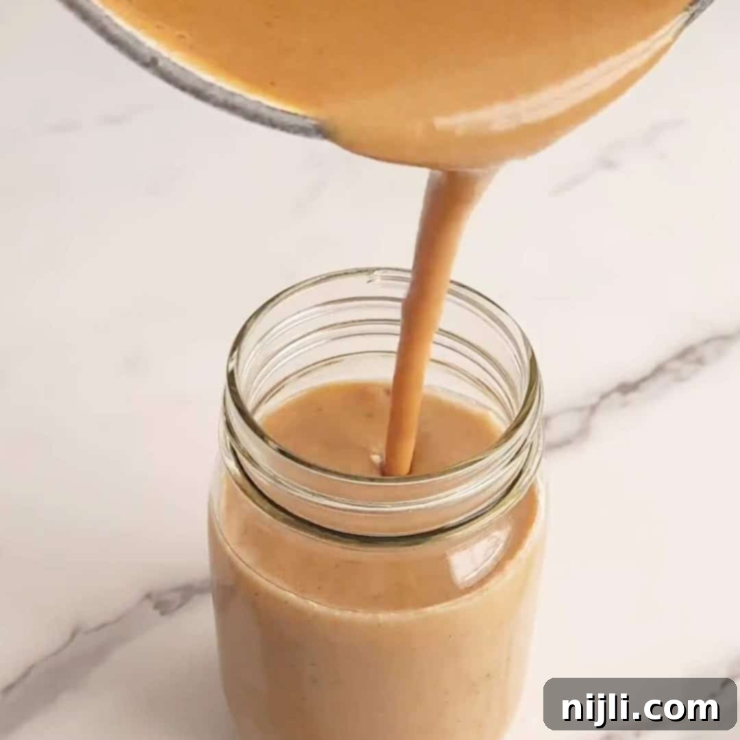 Starbucks Pumpkin Spice Sauce 9 starbucks pumpkin sauce step 4: pouring the cooled sauce into a mason jar