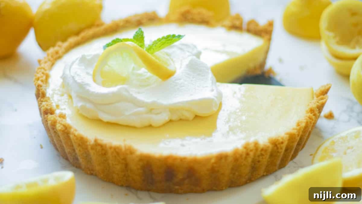 Zesty Lemon Icebox Pie 3 lemon icebox pie with slices cut out